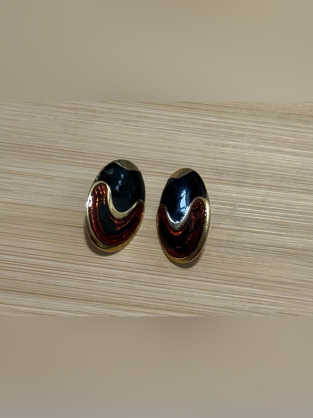 Oval Gold Tone Stud Earrings Featuring Black & Red Enamel